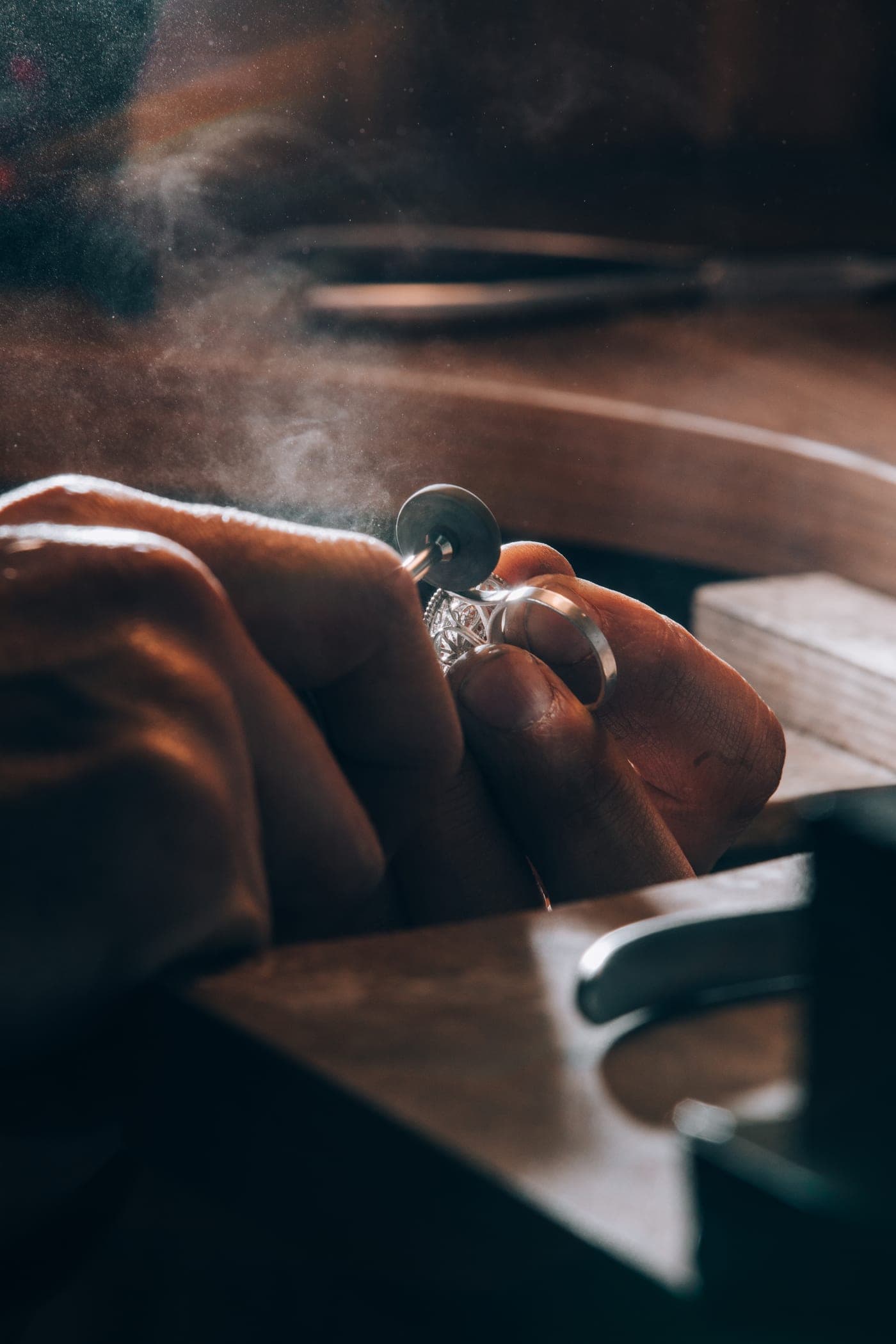 A goldsmith setting a custom ring at the workbench